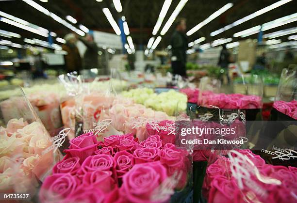 Bunches of roses are displayed on a flower stall in New Covent Garden Flower Market on February 11, 2009 in London, England. New Covent Garden Flower...