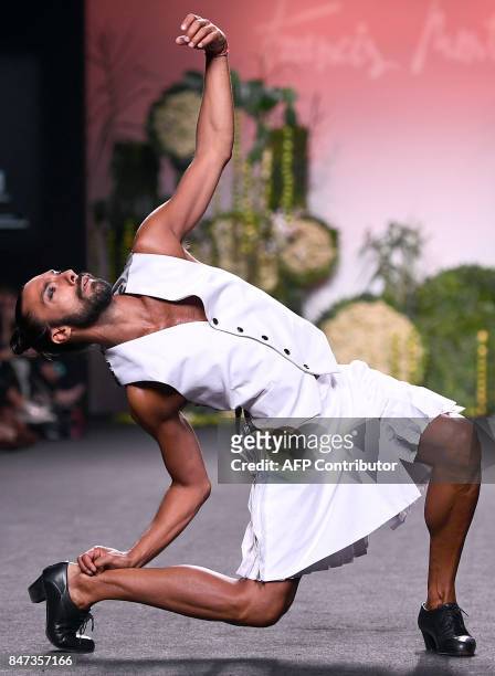 Model presents a creation of Francis Montesinos' Spring/Summer 2018 collection during the Madrid Fashion Week in Madrid on September 15, 2017. / AFP...