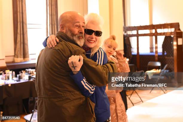 Fashion designer Pam Hogg with photographer Richard Young backstage ahead of the Pam Hogg show during London Fashion Week September 2017 on September...