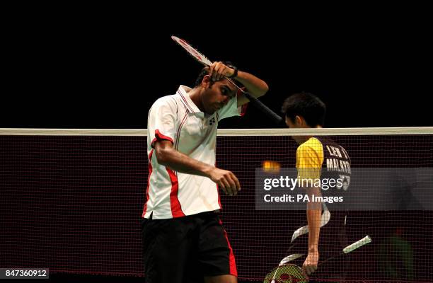 England's Rajiv Ouseph walks off dejected after losing to Malaysia's Daren liew during the Yonex All England Badminton Championships at the National...