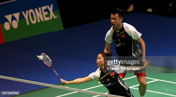 China's Jin Ma and Chen Xu in action during their match against Singapore's Chayut Triyachart and Lei Yao during the Yonex All England Badminton...