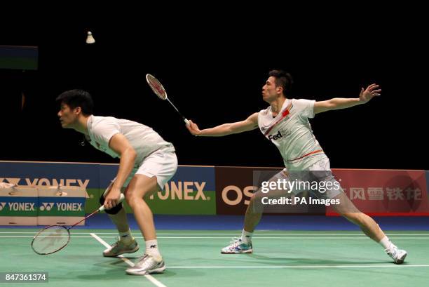 China's Cai Yun and Fu Haifeng return during their match during the Yonex All England Badminton Championships at the National Indoor Arena in...