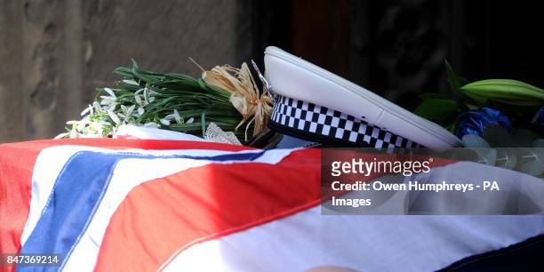 Police hat on top of the coffin of Pc David Rathband, as it arrives at St Nicholas Cathedral, Newcastle, for a service to celebrate his life.