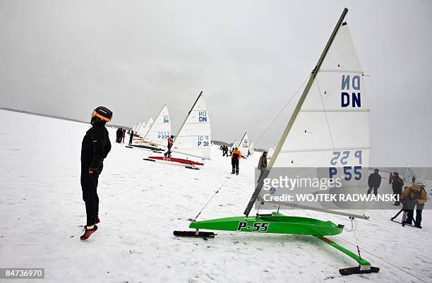 Poland-sports-extreme-sail' DN class type Iceboat skipper Tomasz Zakrzewski is seen warming up before a local competition on the frozen lake Sniardwy...