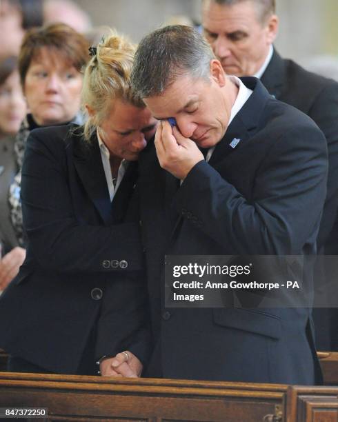 Darren Rathband, twin brother of Pc David Rathband, is supported by his fiancee Angie Stephenson during a memorial service at St Nicholas Cathedral,...
