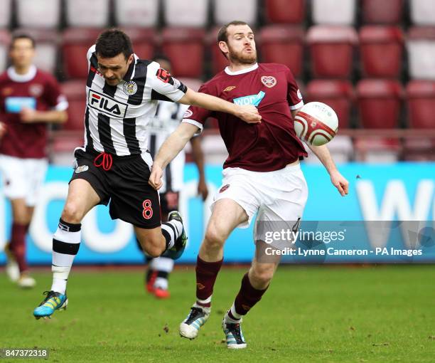 St Mirren's Steven Thomson and Heart's Craig Beattie in action during the Clydesdale Bank Scottish Premier League match at Tynecastle Stadium,...