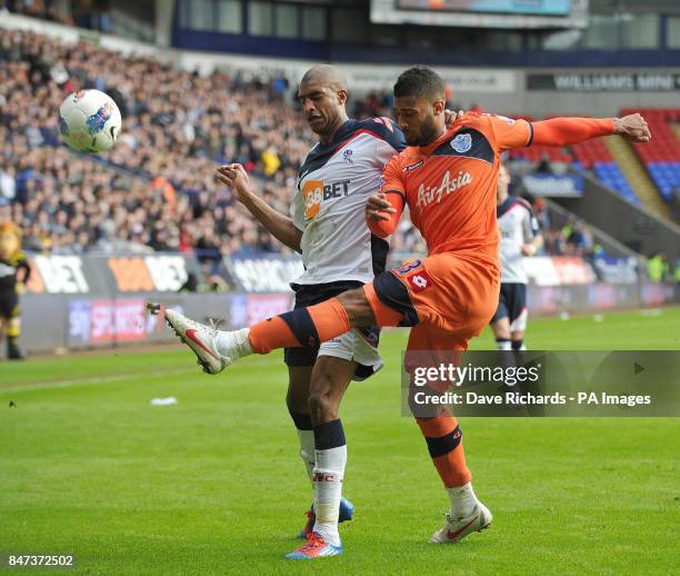 Bolton's David Ngog and QPR's Armand Triore in action during the Barclays Premier League match at the Reebok Stadium, Bolton.