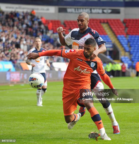 Bolton's David Ngog and QPR's Armand Traore in action during the Barclays Premier League match at the Reebok Stadium, Bolton.