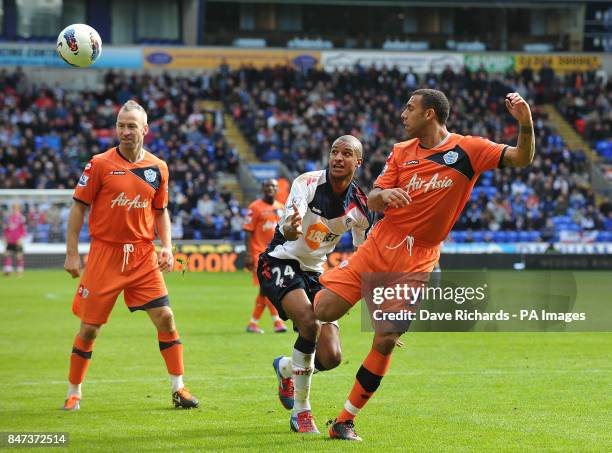 Bolton's David Ngog and QPR's Anton Ferdinand in action during the Barclays Premier League match at the Reebok Stadium, Bolton.