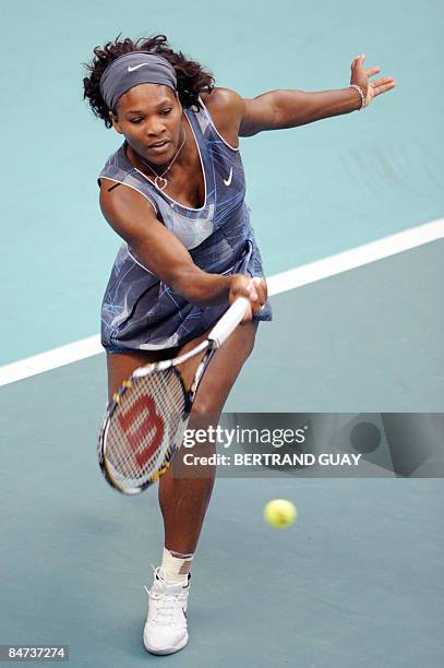 Serena Williams hits a return to her Czech opponent Iveta Benesova during their 17th WTA French Open tennis match on February 11, 2009 in Paris. AFP...