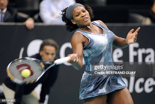 Serena Williams returns the ball to her Czech opponent Iveta Benesova during their 17th WTA French Open tennis match on February 11, 2009 in Paris....