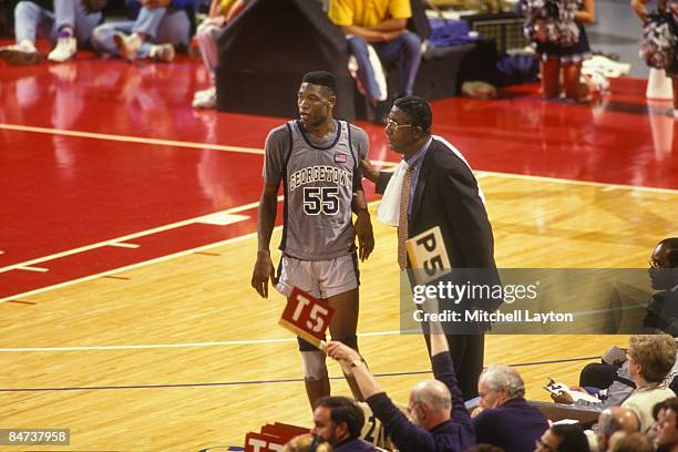 John Thompson, head coach of the Georgetown Hoyas, and Dikembe Mutombo during a college basketball game against the DePaul Blue Demons on December...