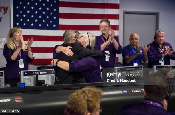 Cassini program manager at JPL, Earl Maize, left, and spacecraft operations team manager for the Cassini mission at Saturn, Julie Webster, right,...