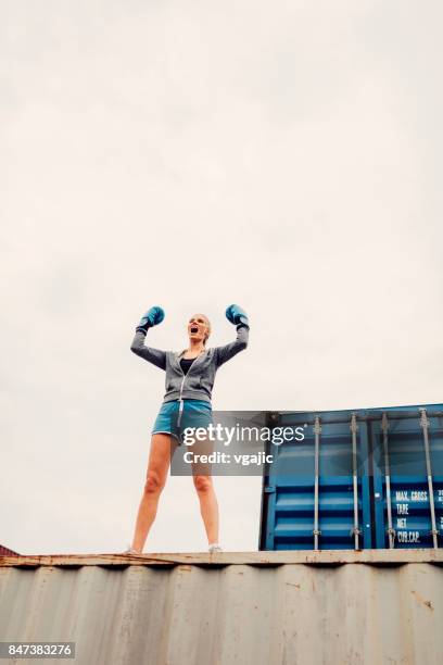 woman shadow boxing - shadow boxing home stock pictures, royalty-free photos & images