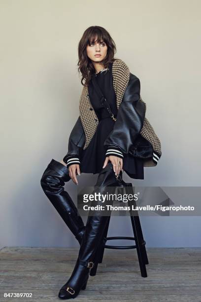 Model Nina K poses at a fashion shoot for Madame Figaro on July 17, 2017 in Paris, France. Jacket , dress , bag , boots . Serrure ring and Seventies...