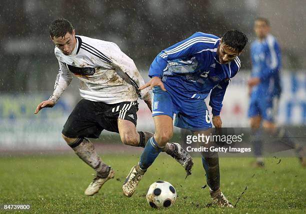 Gentzoglou Savvas of Greece battles for the ball with Fabian Baecker of Germany during the U19 international friendly match between Greece and...