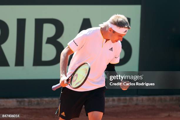 Cedrik-Marcel Stebe of Germany celebrates winning the match against Joao Sousa of Portugal during day one of the Davis Cup World Group Play-off...