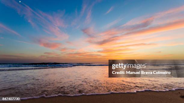 sunset in cádiz - beach dusk stock pictures, royalty-free photos & images