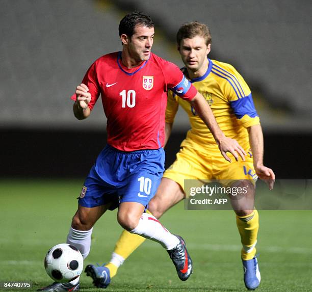 Serbia's Inter Milan player Dejan Stankovic vies with Ukraine's Yevgen Levchenko during their FIFA international friendly football match in Nicosia...