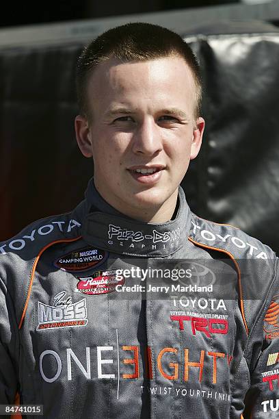 Tayler Malsam, driver of the One Eighty Toyota, waits in the garage area during practice for the NASCAR Camping World Truck Series NextEra Energy...