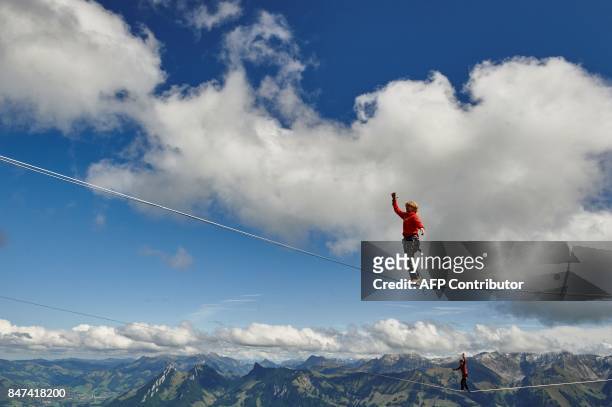Tijmen Van Dieren of Netherlands walks on the line during the Highline Extreme event in Moleson peak, western Switzerland on September 15, 2017....