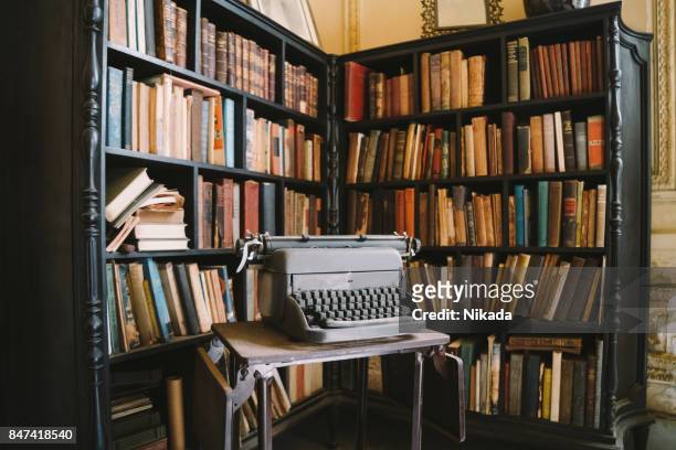 interior of abandoned ornate colonial villa with books and typewriter - havana art stock pictures, royalty-free photos & images