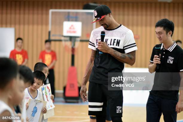 Player George Hill of the Sacramento Kings plays basketball with children at a kindergarten on September 15, 2017 in Guangzhou, China.