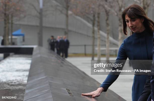 Samantha Cameron, wife of the British Prime Minister, touches the name of Katherine Wolf, a British citizen who died on 9/11 at the memorial at the...