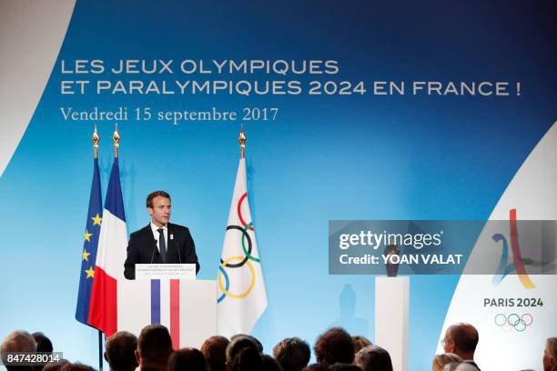 French President Emmanuel Macron delivers a speech during a welcoming ceremony to celebrate Paris' coronation as host of the 2024 Olympics Games at...