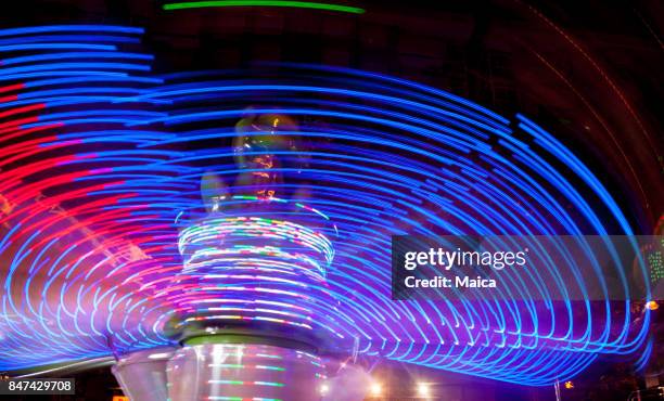 fair attraction at night - rollercoaster loop stock pictures, royalty-free photos & images