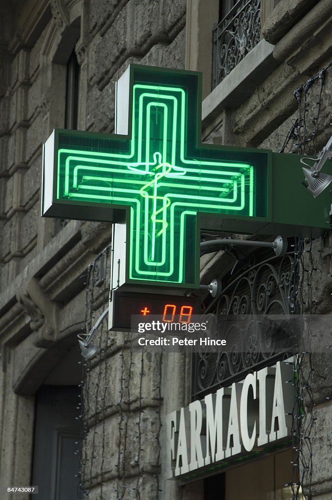 Green Cross sign of Farmacia in MIlan Italy