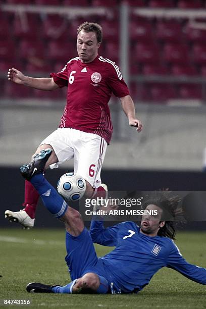 Denmark's Lars Jacobsen fights for the ball with Greece's Georgos Samaras during their friendly football game at the Karaiskaki stadium in Piraeus,...