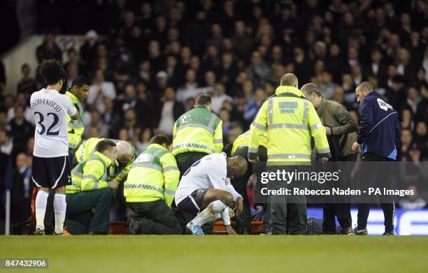 The medical team tend to Bolton Wanderers' Fabrice Muamba as Tottenham Hotspur's Benoit Assou-Ekotto and William Gallas look on