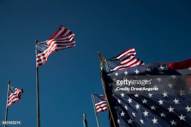 American flags fly during a naturalization ceremony at Liberty State Park, September 15, 2017 in Jersey City, New Jersey. To mark Citizenship Day, 35...