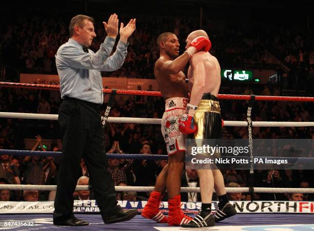 Referee Marcus McDonnell claps Kell Brook after the final bell of the 12th round during his victory over Matthew Hatton during the WBA/IBF...