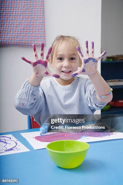 girl finger-painting in classroom - 4 girls finger painting bildbanksfoton och bilder