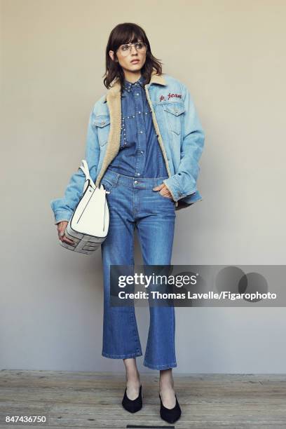 Model Nina K poses at a fashion shoot for Madame Figaro on July 17, 2017 in Paris, France. Jacket , shirt , jeans , shoes , Sellahs Bag , sunglasses...