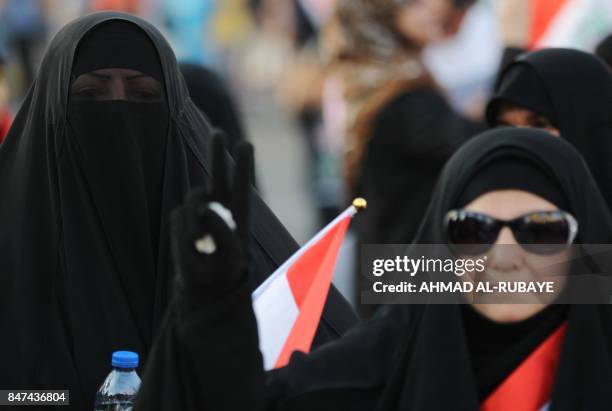 Iraqi women, followers of cleric Moqtada al-Sadr, take part in a demonstration against corruption in Iraq and demanding reform and a change in the...