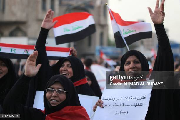 Iraqi women, followers of cleric Moqtada al-Sadr, take part in a demonstration against corruption in Iraq and demanding reform and a change in the...