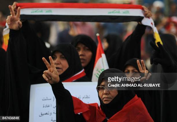 Iraqi women, followers of cleric Moqtada al-Sadr, take part in a demonstration against corruption in Iraq and demanding reform and a change in the...