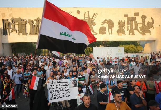 Iraqi followers of cleric Moqtada al-Sadr take part in a demonstration against corruption in Iraq and demanding reform and a change in the electoral...