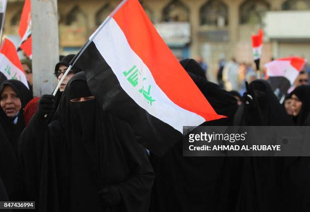 Iraqi women, followers of cleric Moqtada al-Sadr, take part in a demonstration against corruption in Iraq and demanding reform and a change in the...