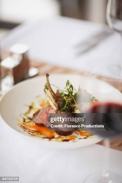 gourmet entree in restaurant - lamb chop stock pictures, royalty-free photos & images