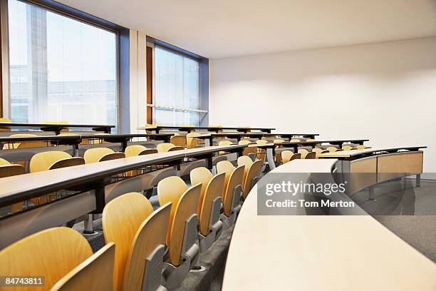 rows of folding chairs and tables - team training business stock pictures, royalty-free photos & images