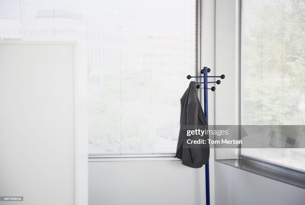 Jacket Hanging On Rack Suit Jacket Hanging On Office Coat Rack High-Res Stock Photo - Getty Images