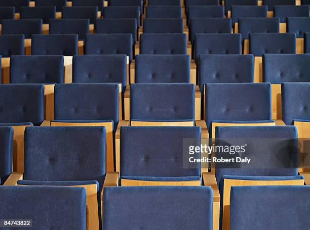 rows of empty seats in conference room - auditoria stockfoto's en -beelden