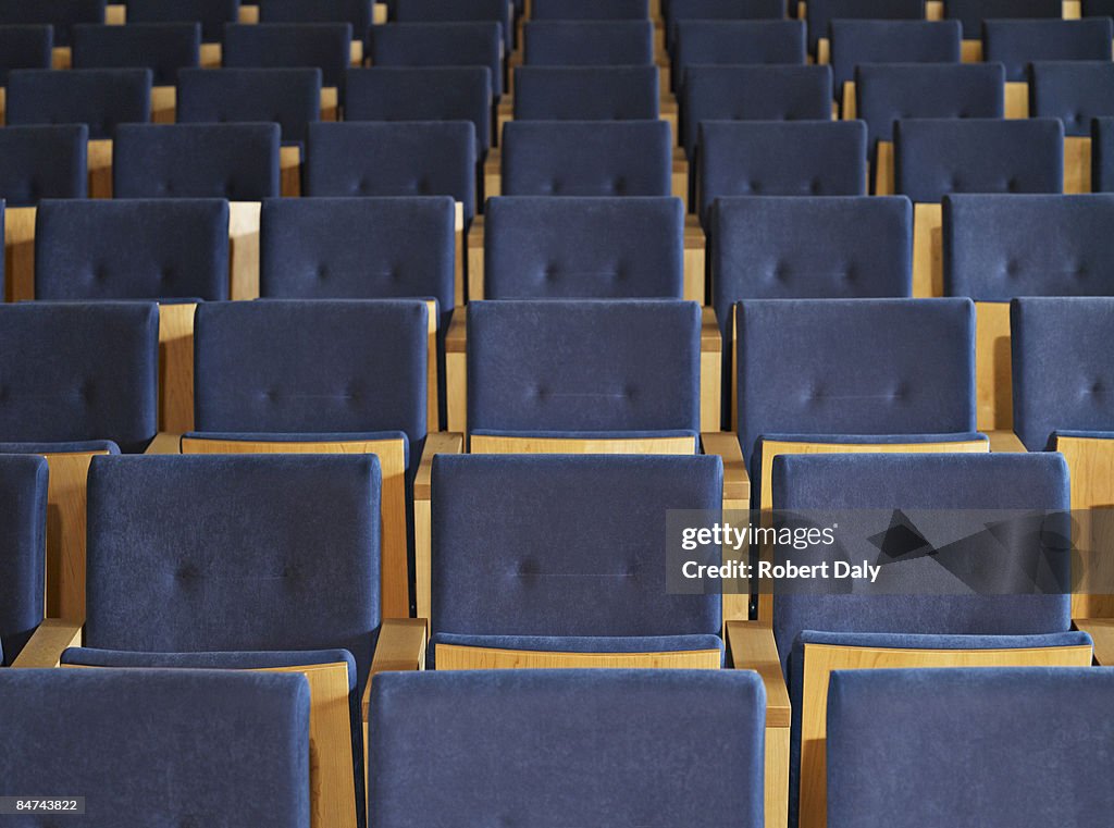 Rows of empty seats in conference room