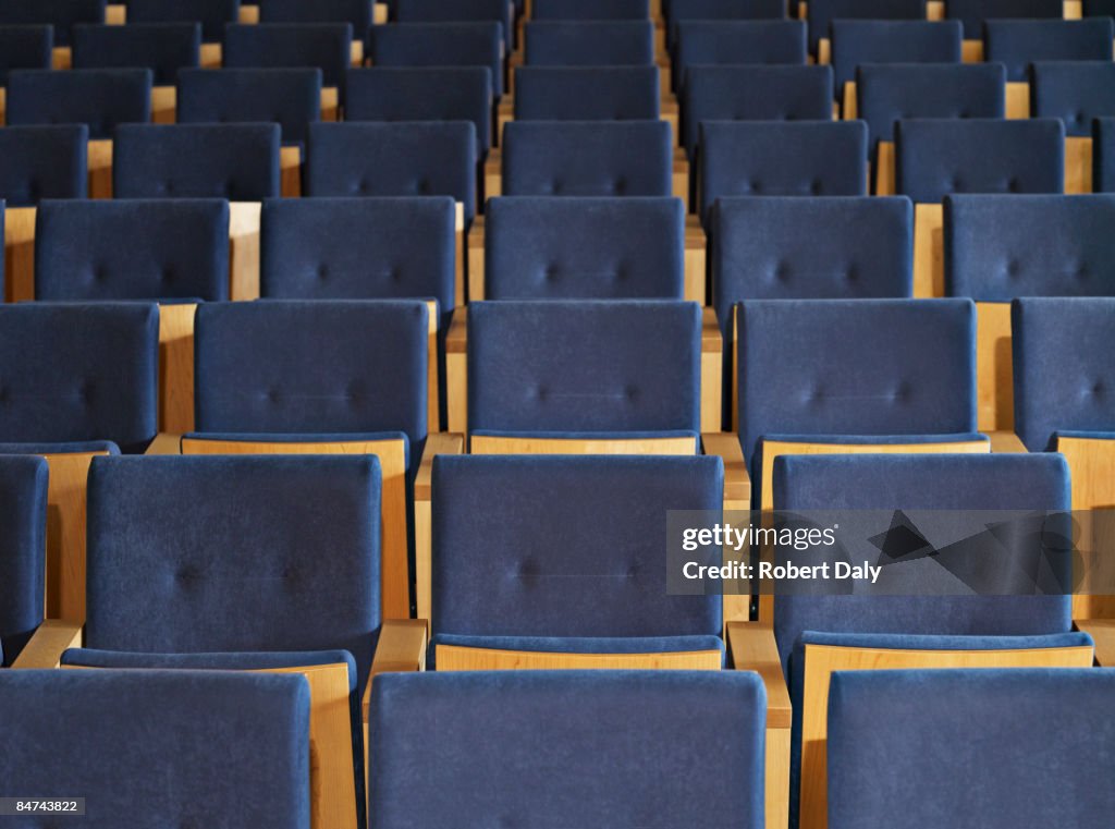 Rows of empty seats in conference room