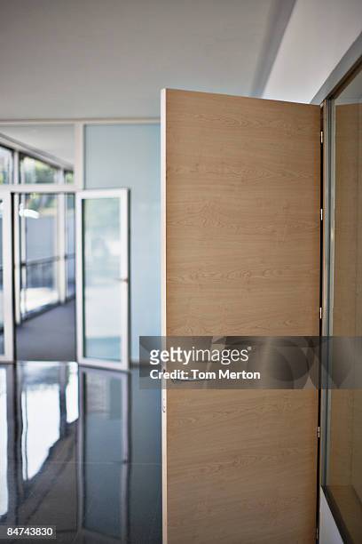 open door in office building - tom chance stock pictures, royalty-free photos & images