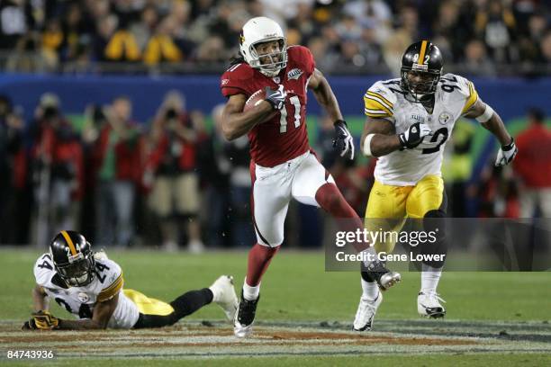 Arizona Cardinals wide receiver Larry Fitzgerald scores a 64 yard touchdown against the Pittsburgh Steelers during Super Bowl XLIII on February 1,...